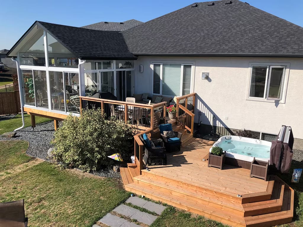 white gable sunroom with a deck by SunCo in Sage Creek, Winnipeg