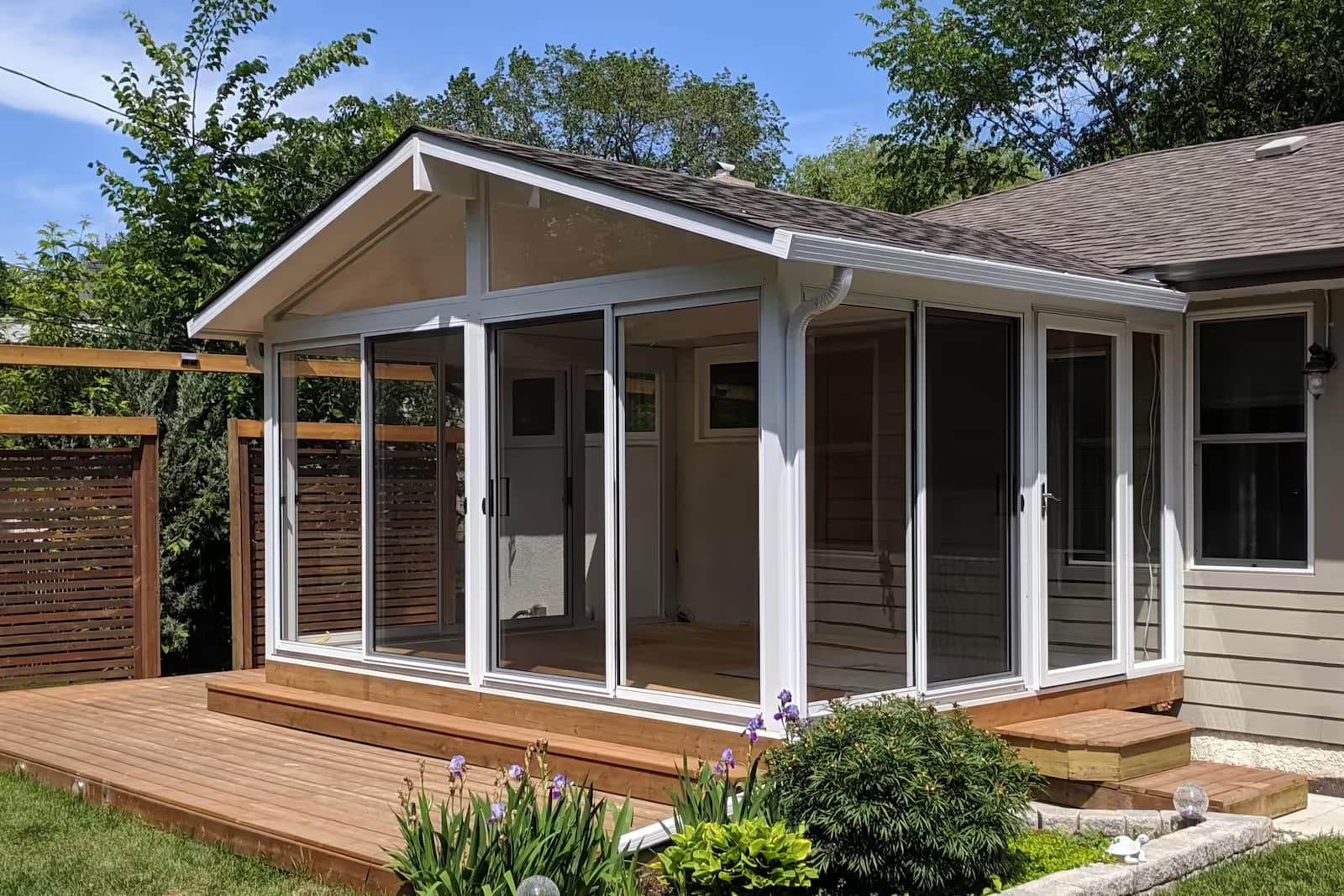 white gable sunroom with treated deck westwood winnipeg