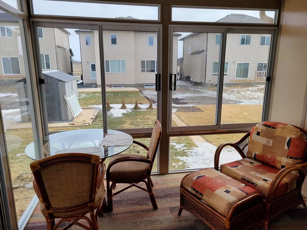 snadalwood and white studio sunroom by SunCo in West St. Paul, Manitoba