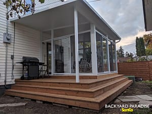 White studio sunroom with wrap around stadium staircase and covered deck , River Heights, Winnipeg , Manitoba 2