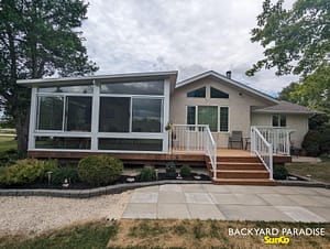 White studio sunroom with treated wood deck and white aluminum picket railings East st Paul 1